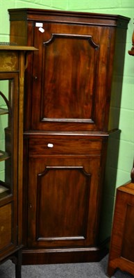 Lot 1334 - A 19th century mahogany corner cupboard on stand