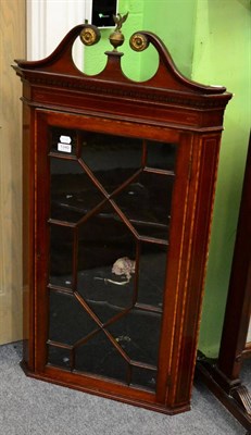 Lot 1340 - A 19th century inlaid mahogany astragal glazed hanging corner cupboard