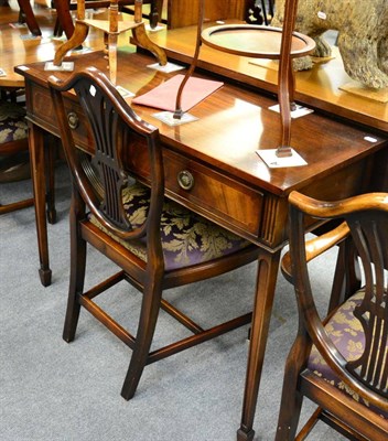 Lot 1358 - A reproduction mahogany serpentine sideboard and a similar two drawer side table