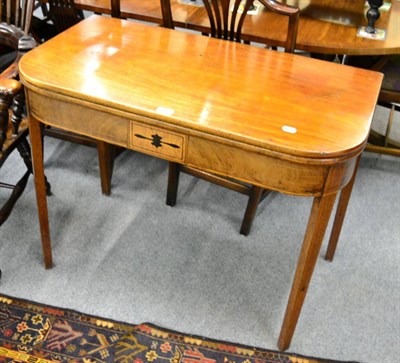 Lot 1362 - A 19th century mahogany fold over tea table