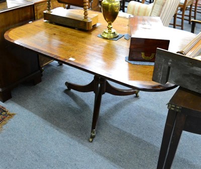 Lot 1369 - A 19th century cross banded mahogany tilt top pedestal breakfast table