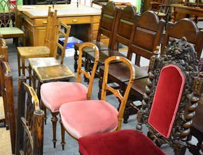 Lot 1404 - A pair of Victorian carved and stained oak high back chairs and a pair of Victorian parlour chairs