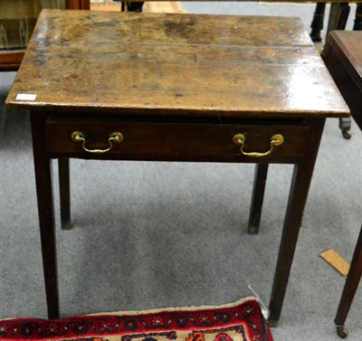 Lot 1407 - An early 19th century oak side table fitted with a drawer