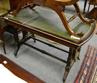 Lot 1410 - An aesthetic part ebonised and parcel gilt leather inset writing table in the manner of Gillows