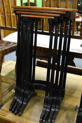 Lot 1427 - A set of mahogany and ebonised quartetto nesting tables, in Regency style, raised on fluted...