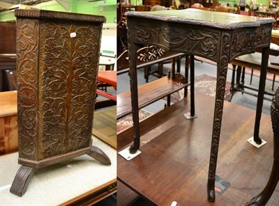 Lot 1432 - A carved oak occasional table on paw feet together with a carved oak corner stand