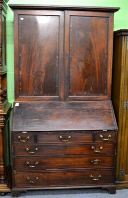 Lot 1455 - An early 19th century mahogany bureau bookcase