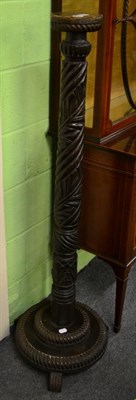 Lot 1459 - A 19th century carved oak torchere on part gadrooned stepped base and three feet