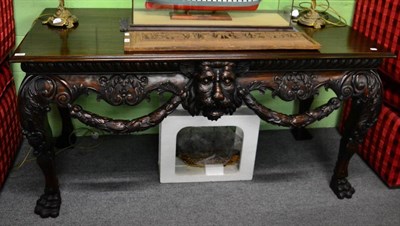 Lot 1465 - A mahogany serving table with lions mask front