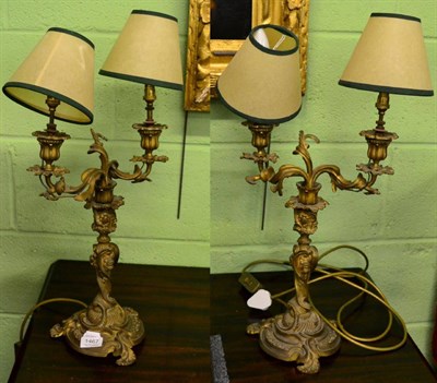 Lot 1467 - A pair of gilt metal electric fitted table lamps