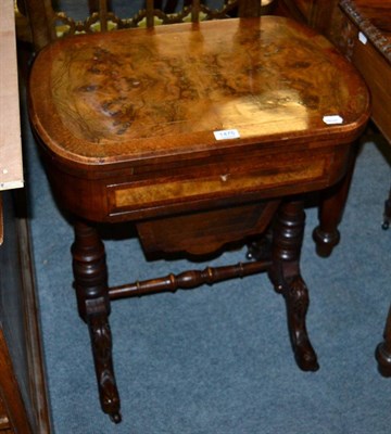 Lot 1475 - A Victorian walnut veneered games/sewing table