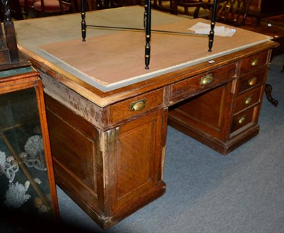 Lot 1476 - An early 20th century oak partners desk the drawer stamped 'Gillows'