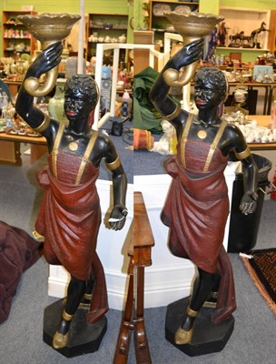 Lot 1480 - A pair of large reproduction Blackamoor figures, holding a torch aloft