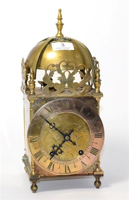 Lot 3 - A brass lantern type striking mantel clock, chapter ring signed by retailer Rattray & Co, Dundee