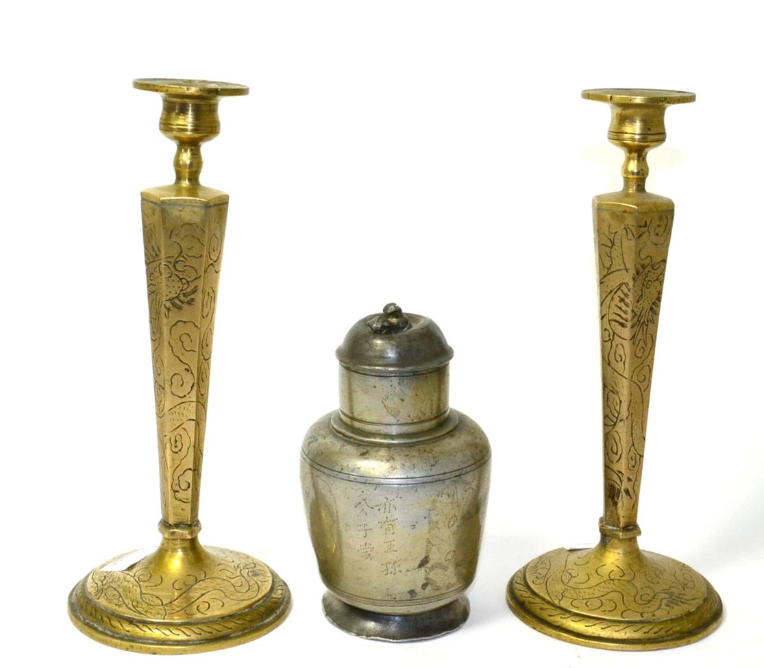Lot 25 - A Chinese pewter plum wine flask, Qing, 16cm high; and a pair of brass candlesticks with...