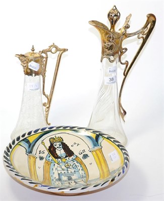 Lot 38 - WMF style claret jug, another claret jug and a modern tin glazed earthenware dish