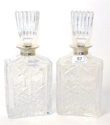 Lot 57 - A pair of silver mounted decanters