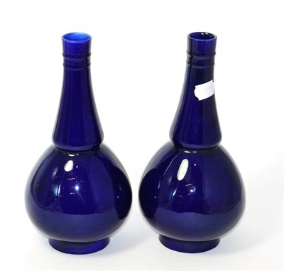 Lot 59 - A pair of Minton blue glazed bottle vases