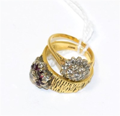 Lot 81 - A garnet and diamond ring and a diamond cluster ring (2)
