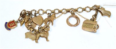 Lot 82 - A 9ct gold charm bracelet with ten various charms