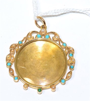 Lot 87 - A turquoise and seed pearl locket pendant, the central circular glazed locket with a wreath...