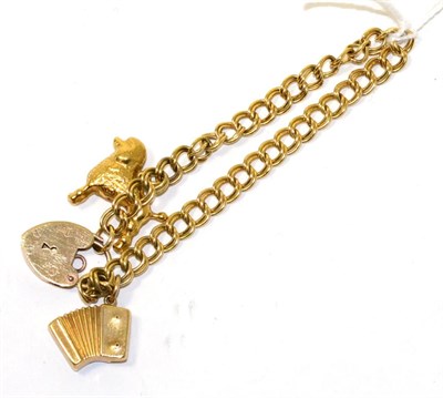 Lot 102 - A 9ct gold charm bracelet with two charms