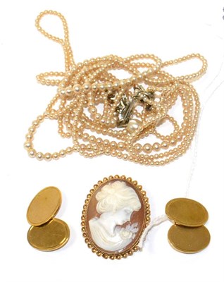 Lot 115 - A pair of 9ct gold double oval cufflinks, a cameo brooch, and a simulated pearl necklace (3)