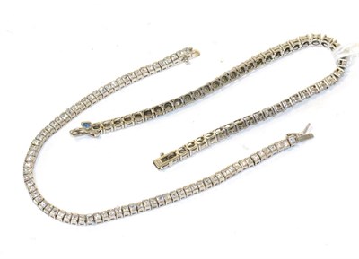 Lot 124 - A 9ct white gold diamond line bracelet and a silver white stone line bracelet (2)
