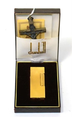 Lot 131 - Dunhill lighter with paperwork in original box (unused) and a continental crucifix