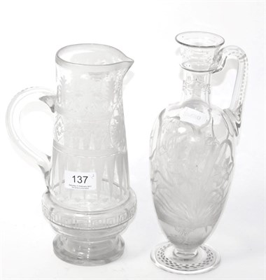 Lot 137 - An engraved glass ewer and another