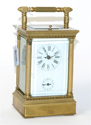 Lot 142 - A reproduction brass striking and repeating alarm centre seconds carriage clock