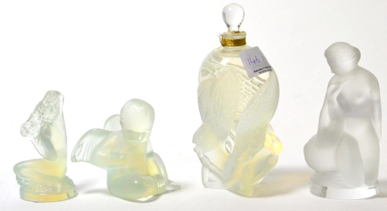 Lot 146 - A modern Lalique perfume bottle and three modern Lalique opalescent and frosted figures