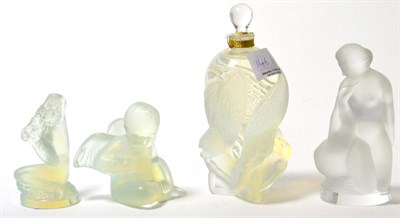 Lot 146 - A modern Lalique perfume bottle and three modern Lalique opalescent and frosted figures