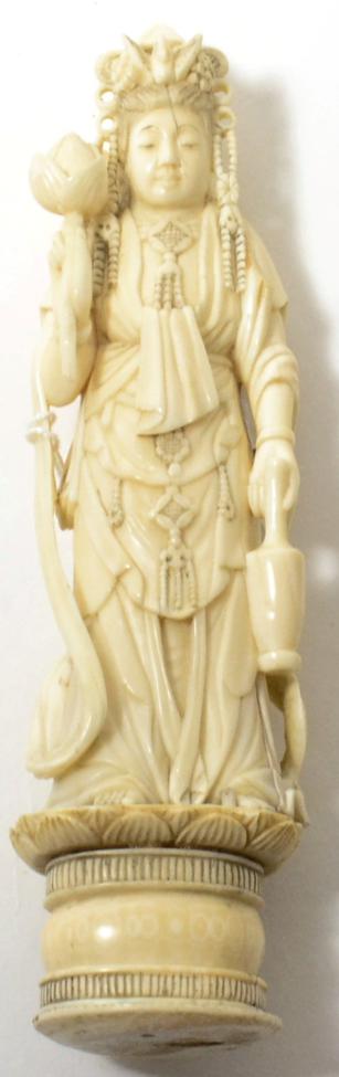 Lot 154 - A Chinese ivory figure of Guanyin, late 19th/early 20th century, on lotus plinth base