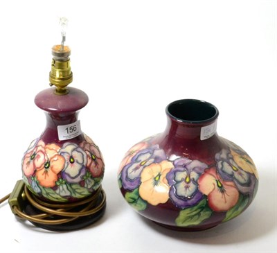 Lot 156 - A Walter Moorcroft Pansy pattern table lamp (16cm including fittings) and a matching ovoid vase...