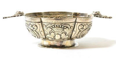 Lot 158 - A Dutch silver brandy bowl of lobed oval form with cast handles, 17cm wide