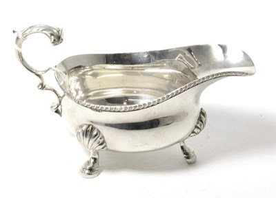 Lot 160 - A Barraclough & Sons silver sauce boat with C scroll handle and hoof feet