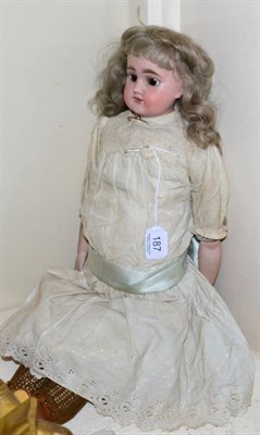 Lot 187 - Bisque shoulder head doll, impressed 309.10, with blond wig, sleeping brown eyes, on a kid...