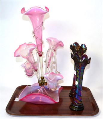 Lot 238 - A Victorian pink glass epergne together with two iridescent glass vases