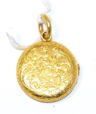 Lot 258 - A Victorian foliate engraved circular locket pendant, the interior inscribed 'Harry Han 19th 1858'