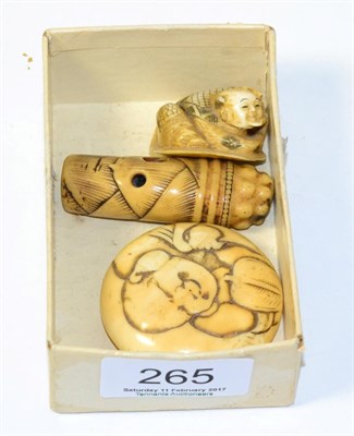 Lot 265 - Three early 20th century Japanese ivory netsukes including a manju example