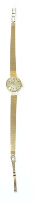 Lot 268 - A lady's 9ct gold cased Tissot wristwatch on a 9ct gold bracelet strap