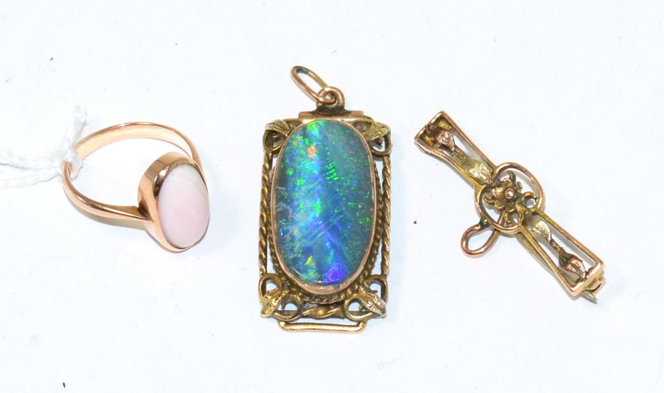 Lot 314 - A black opal pendant, a coral ring, stamped '9CT' and a brooch (3)