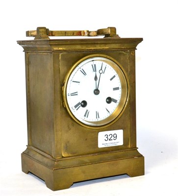 Lot 329 - A brass striking mantel timepiece