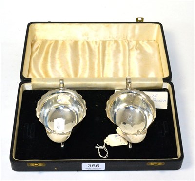 Lot 356 - A pair of silver sauce boats in fitted case