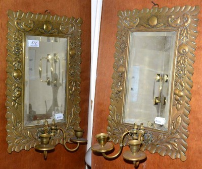 Lot 372 - A pair of Arts & Crafts mirrored wall sconces