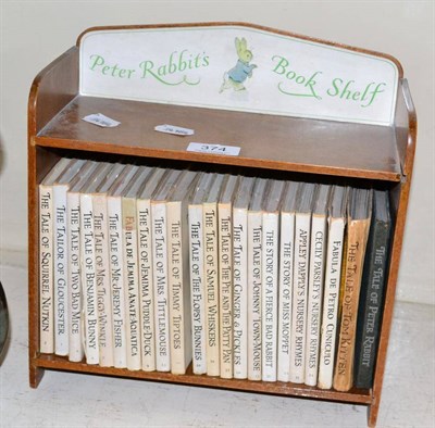 Lot 374 - Peter Rabbit's bookshelf containing twenty two various Beatrix Potter Titles