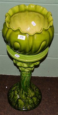 Lot 378 - A Bretby pottery green glazed jardiniere on stand