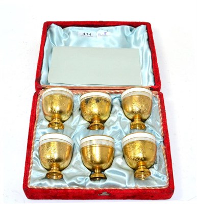 Lot 414 - Six Russian porcelain cups with Egyptian gilt metal mounts, cased