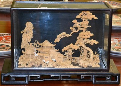 Lot 438 - A Japanese cork diorama of a pagoda and trees with cranes in the foreground, in a glazed case...